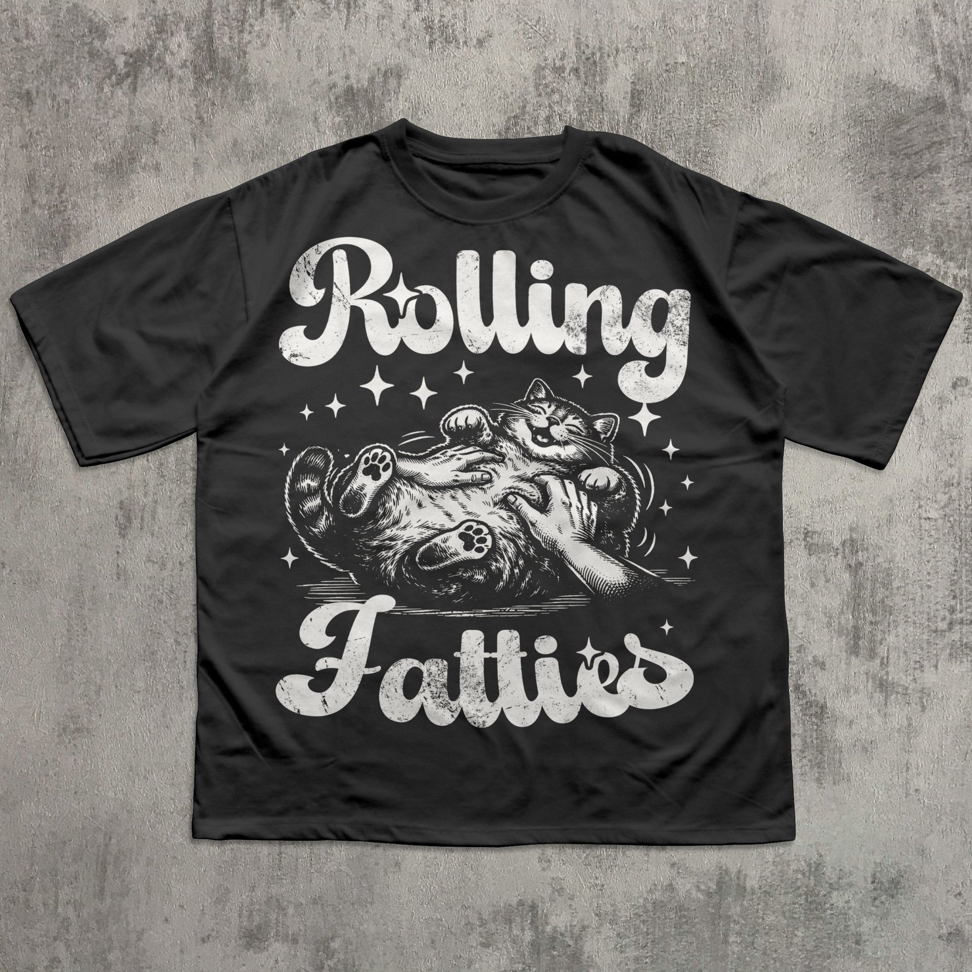 Black t-shirt with graphic design and text 'Rolling Fatties' on a textured gray background