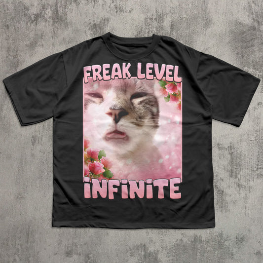 Funny Black t-shirt with a cat graphic and 'Freak Level Infinite' text on a concrete background