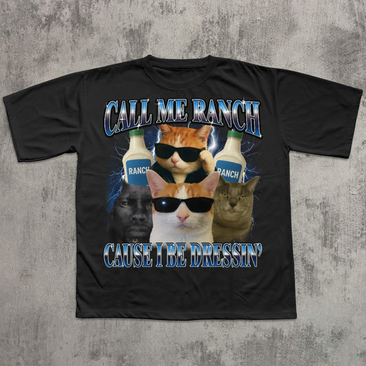 Black t-shirt with cat graphic and text 'Call Me Ranch Cause I Be Dressin'' on a textured gray background