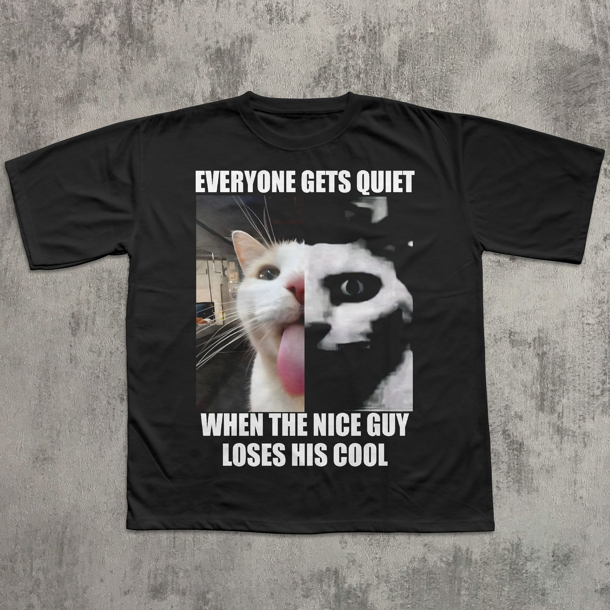 Black t-shirt with a graphic of two cats and text on a textured gray background
