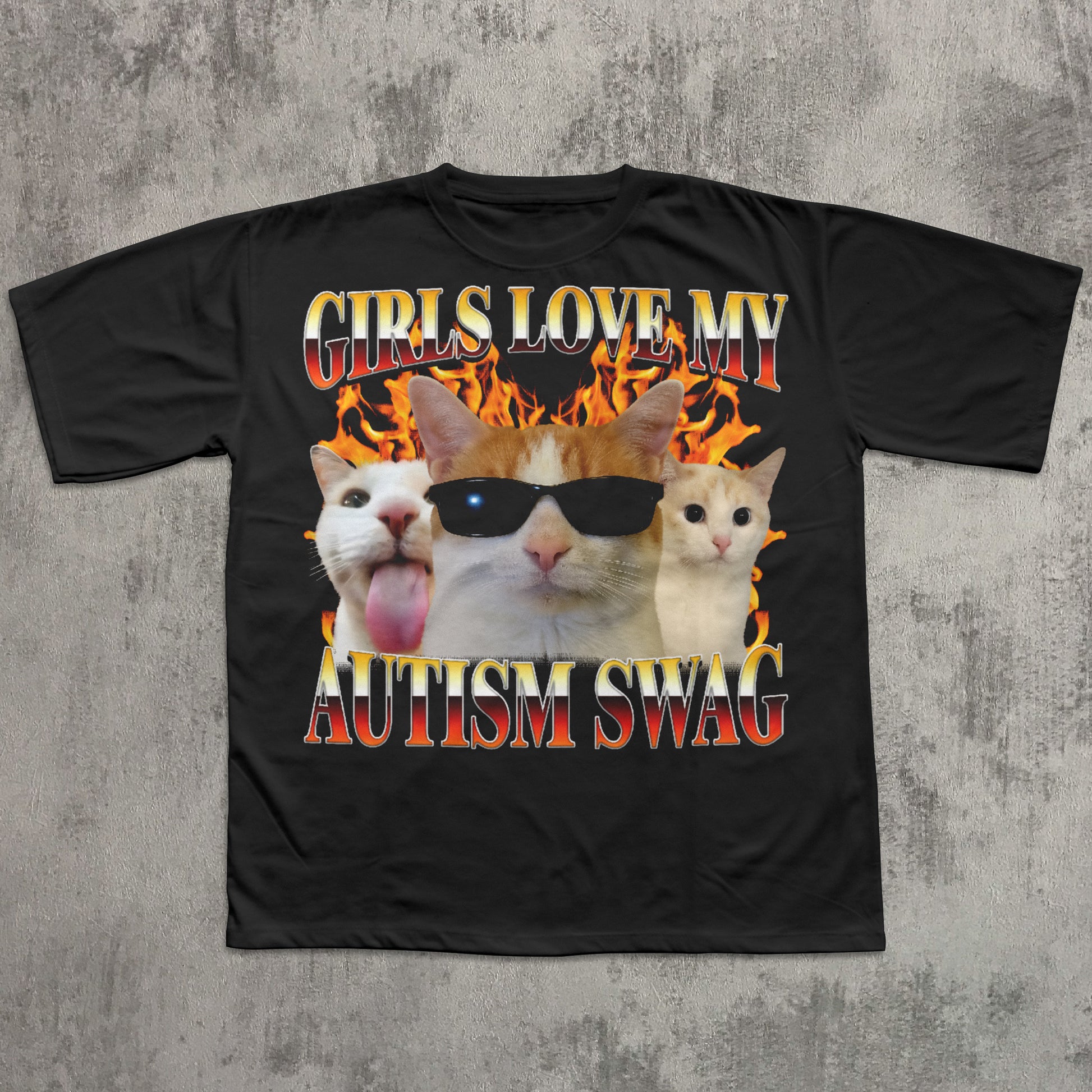 Black t-shirt with cat graphic and text 'Girls love my autism swag' on a textured gray background