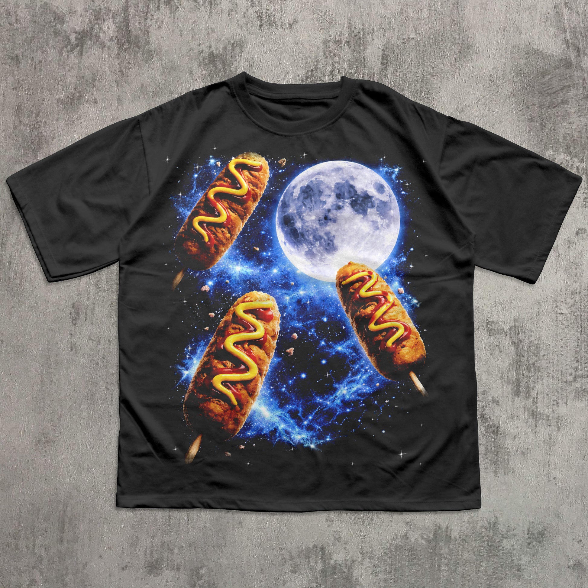 Black t-shirt with hot dog graphic against a concrete wall