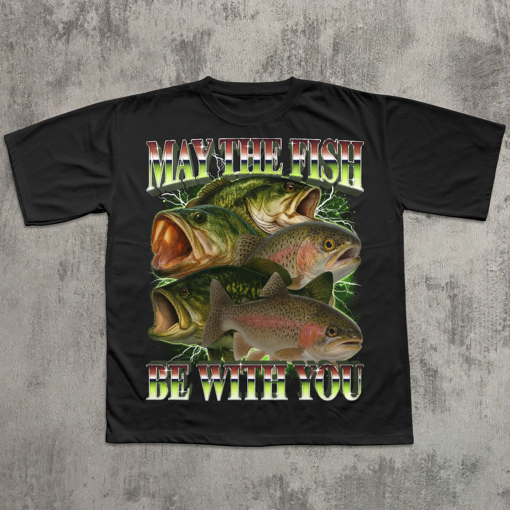 Black t-shirt with fish graphic and text 'May the fish be with you' on a textured gray background