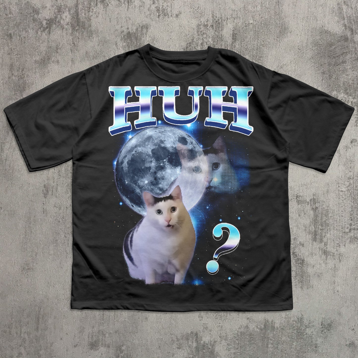 Black t-shirt with a cat graphic and 'HUH?' text on a textured gray background