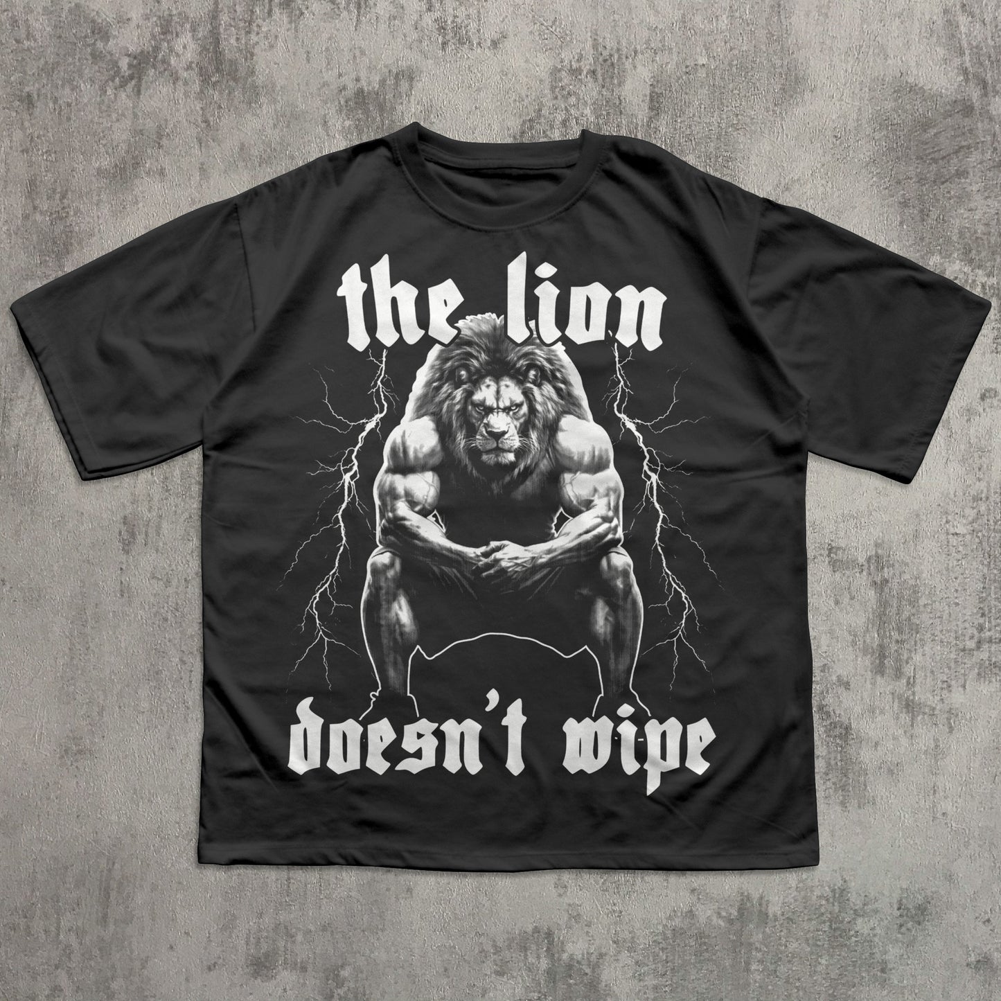 Black t-shirt with a graphic of a lion and text on a concrete background