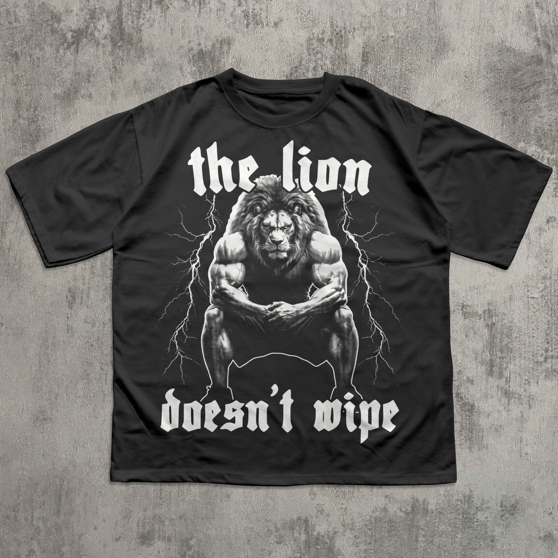 Black t-shirt with a graphic of a lion and text on a concrete background