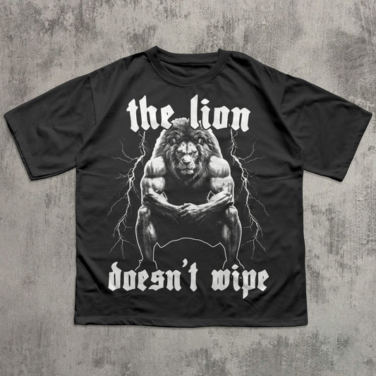 Black t-shirt with a graphic of a lion and text on a concrete background