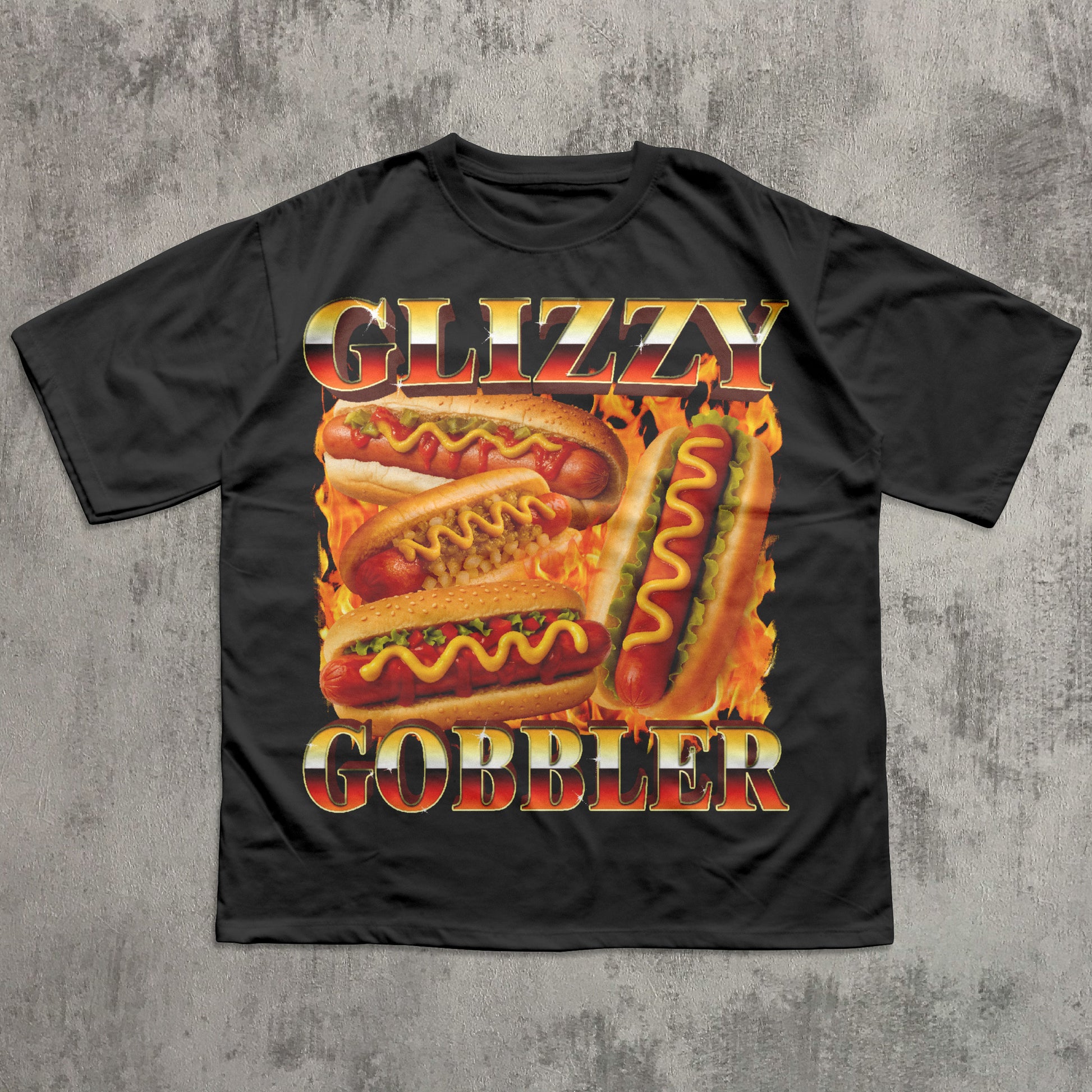 Black t-shirt with 'Glizzy Gobbler' hot dog graphic on a textured gray background