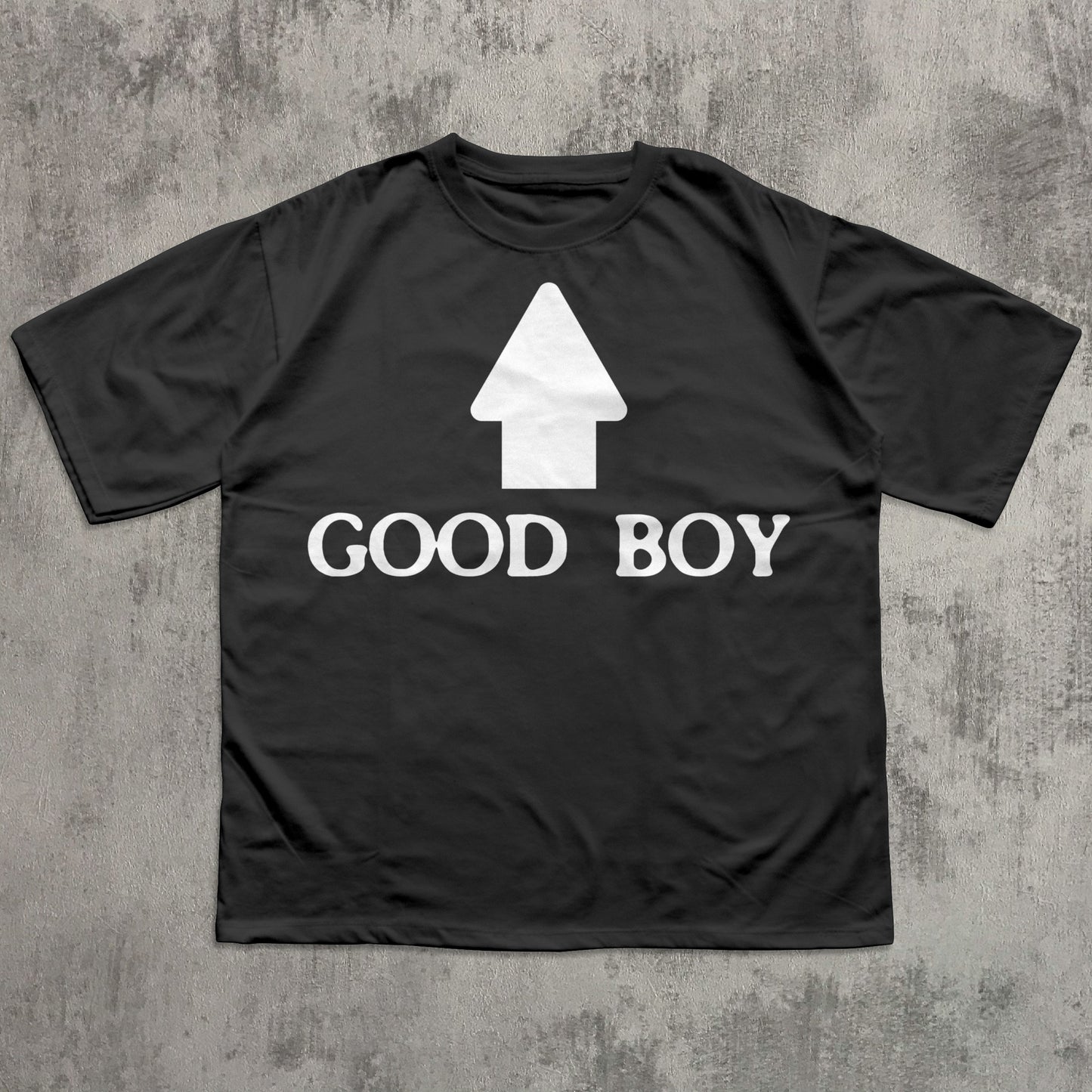 Black t-shirt with 'GOOD BOY' text and white graphic on a textured gray background