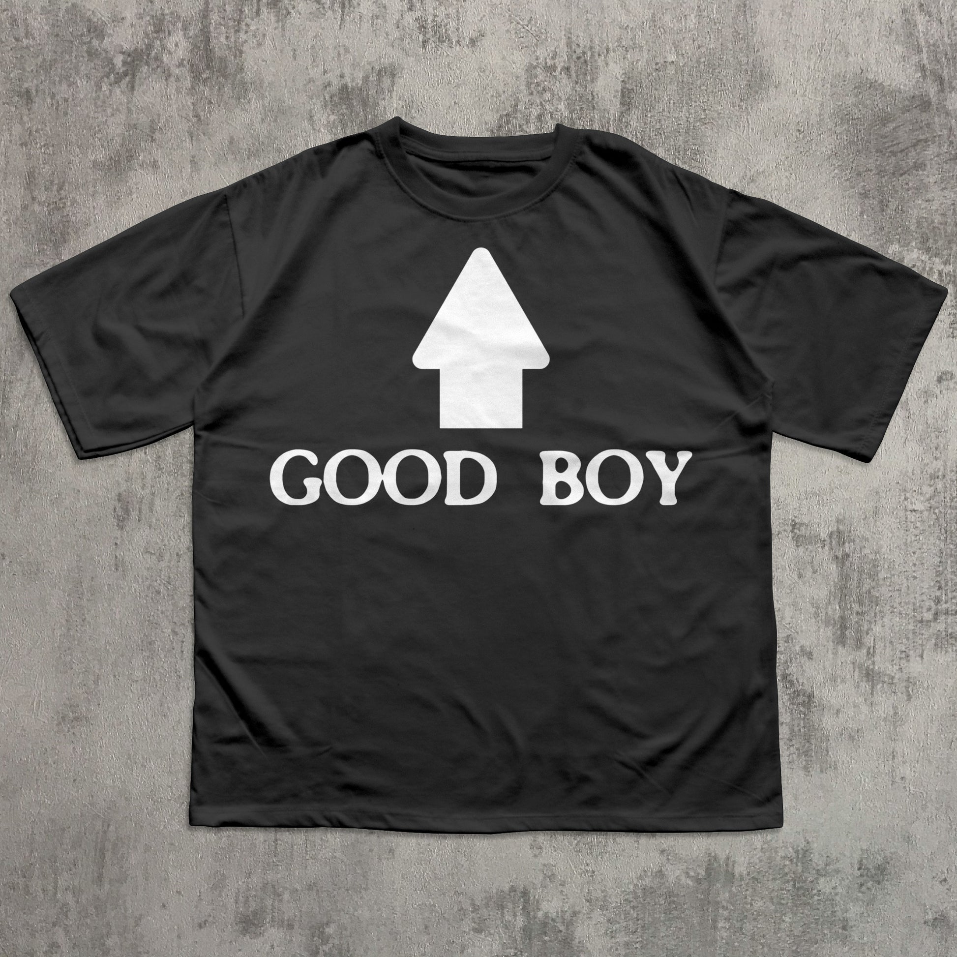 Black t-shirt with 'GOOD BOY' text and white graphic on a textured gray background