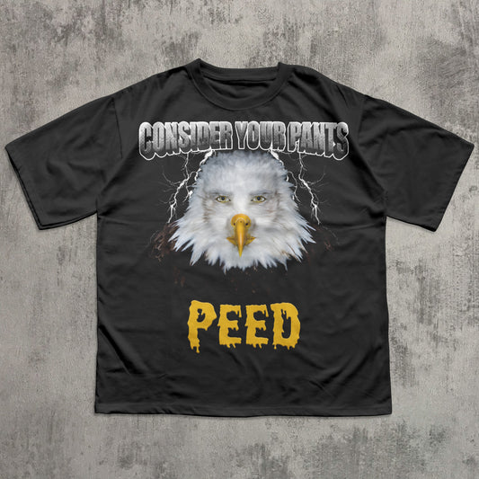 Consider Your Pants Peed Funny black t-shirt with an eagle graphic and text on a textured gray background