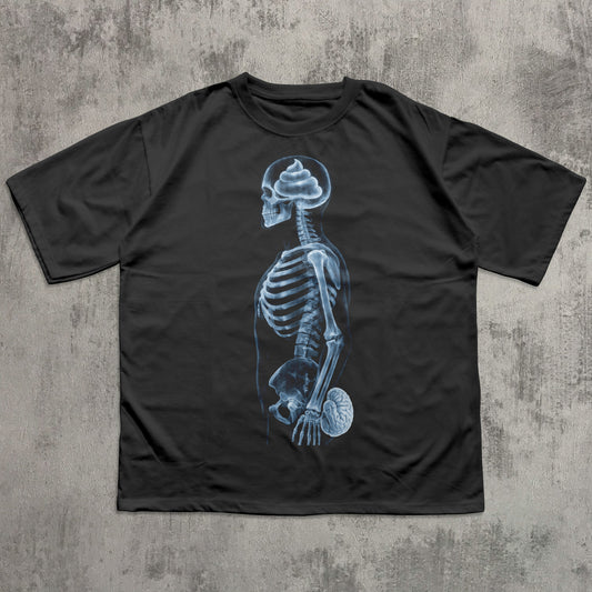 Humorous black graphic T-shirt featuring a blue X-ray skeleton with a poop-shaped brain in the skull and the brain held at the crotch, funny anatomy joke shirt