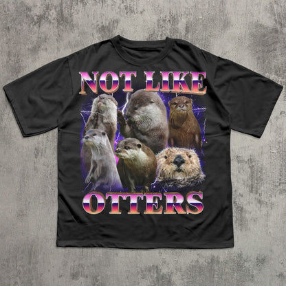 Black t-shirt with otter graphic and 'Not Like Otters' text on a textured gray background