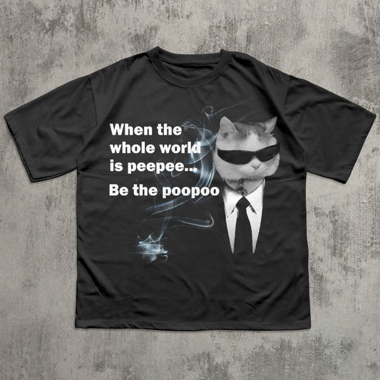 Black t-shirt with a graphic of a cat in sunglasses and a suit, text, and a concrete background