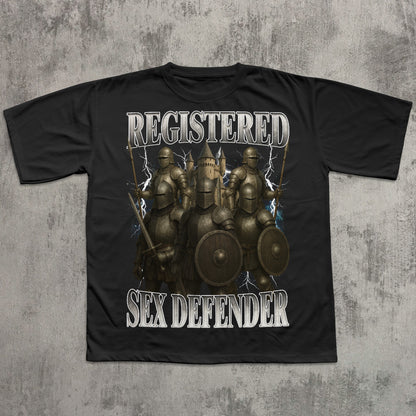 Black t-shirt with warrior graphic and 'Registered Sex Defender' text on a textured gray background