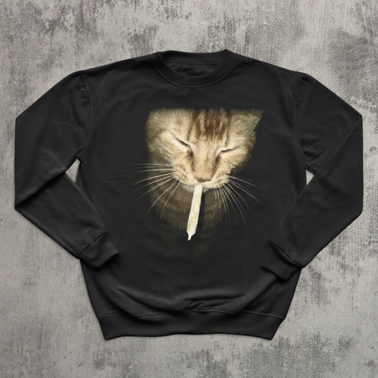 Black sweatshirt with a cat graphic on a textured gray background