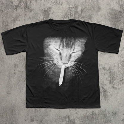 Black t-shirt with a cat graphic on a textured gray background