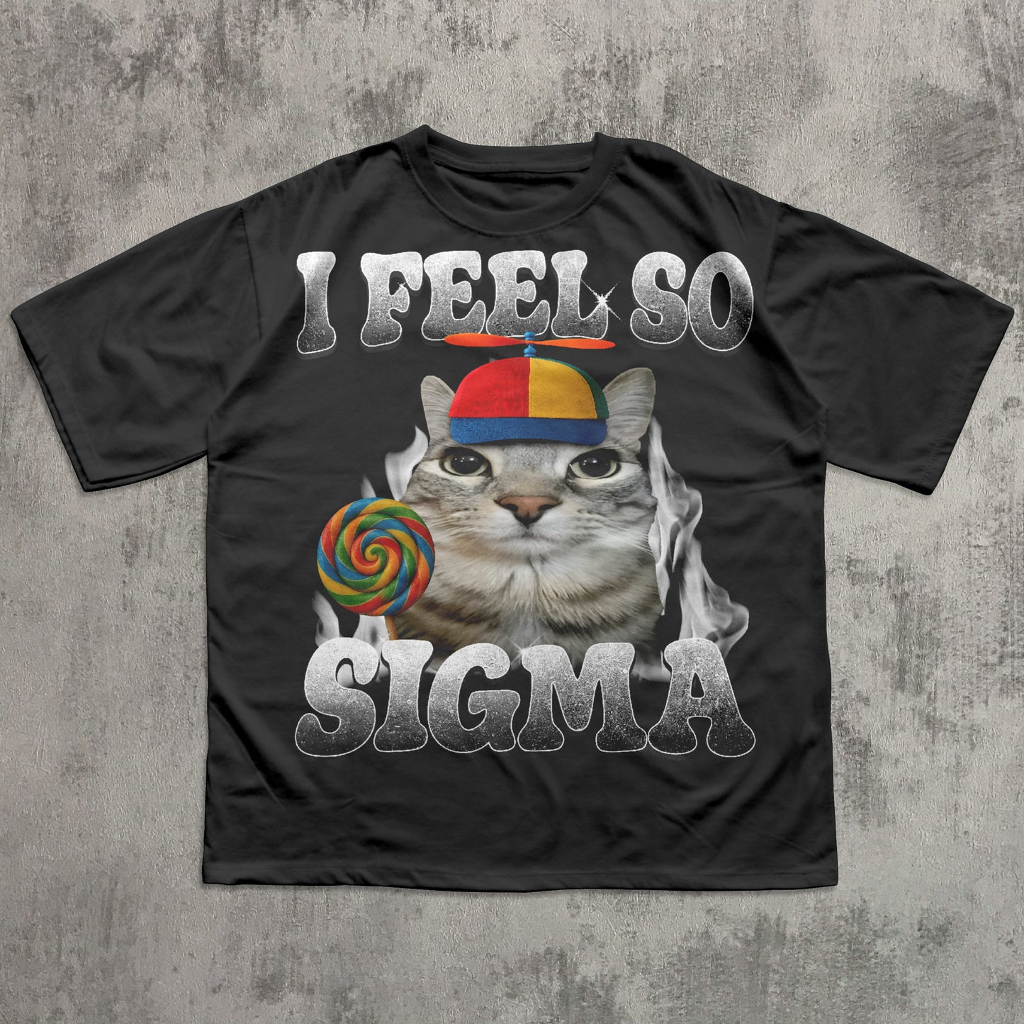 Black t-shirt with a cat meme graphic and text 'I Feel So Sigma' on a textured gray background