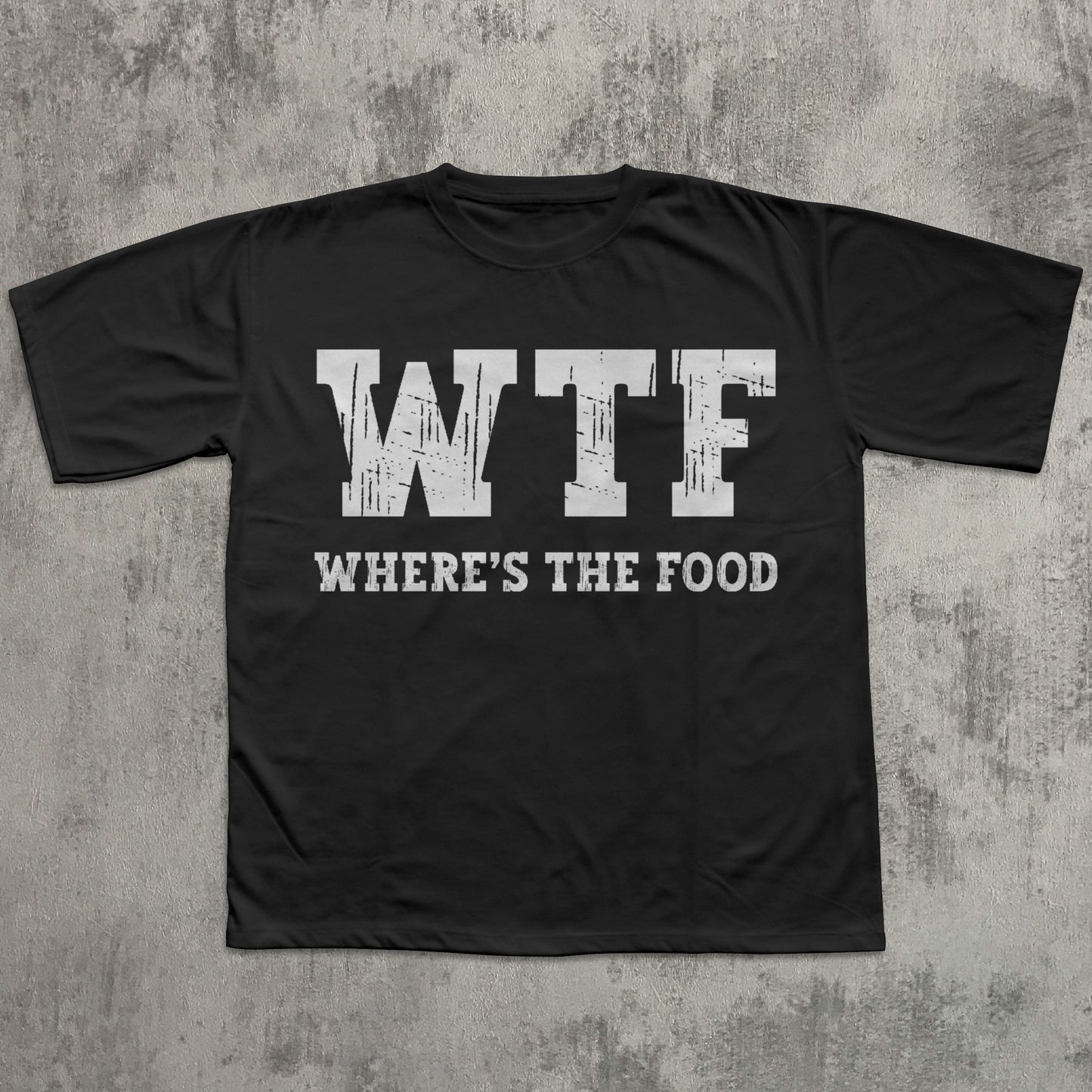 Black t-shirt with 'WTF WHERE'S THE FOOD' text on a textured gray background