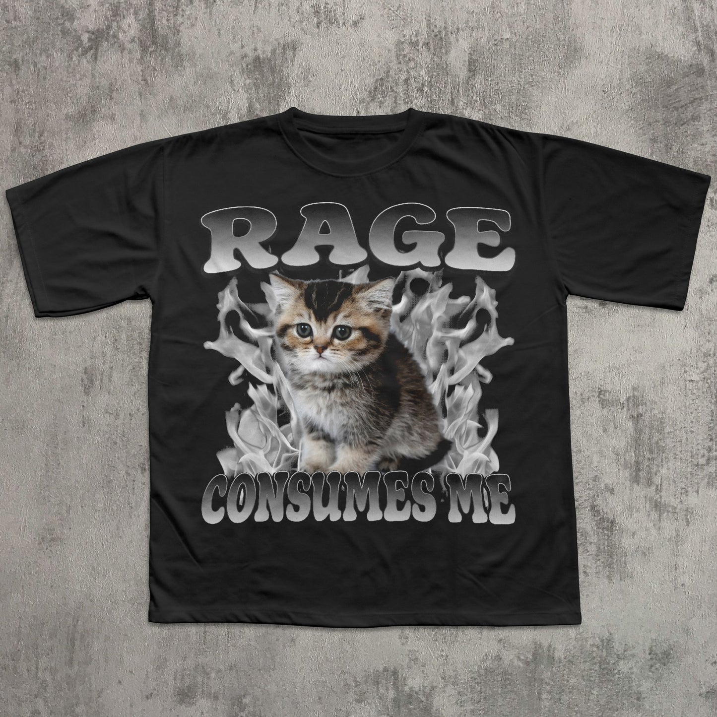 Black t-shirt with a graphic of a kitten and text 'RAGE CONSUMES ME' on a textured gray background