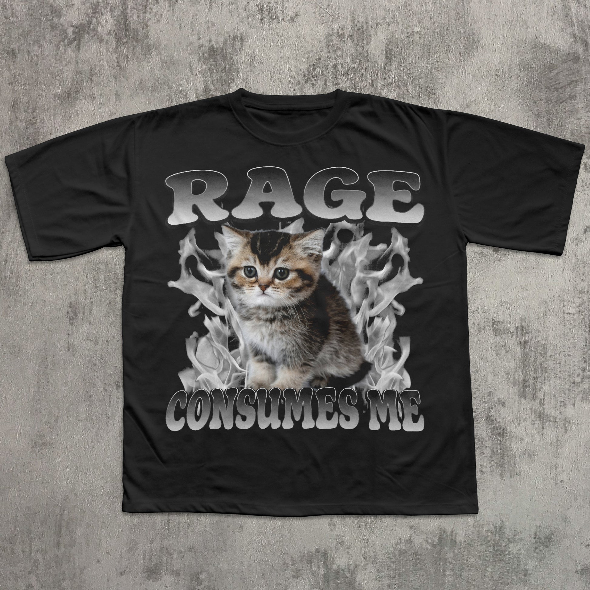 Black t-shirt with a graphic of a kitten and text 'RAGE CONSUMES ME' on a textured gray background