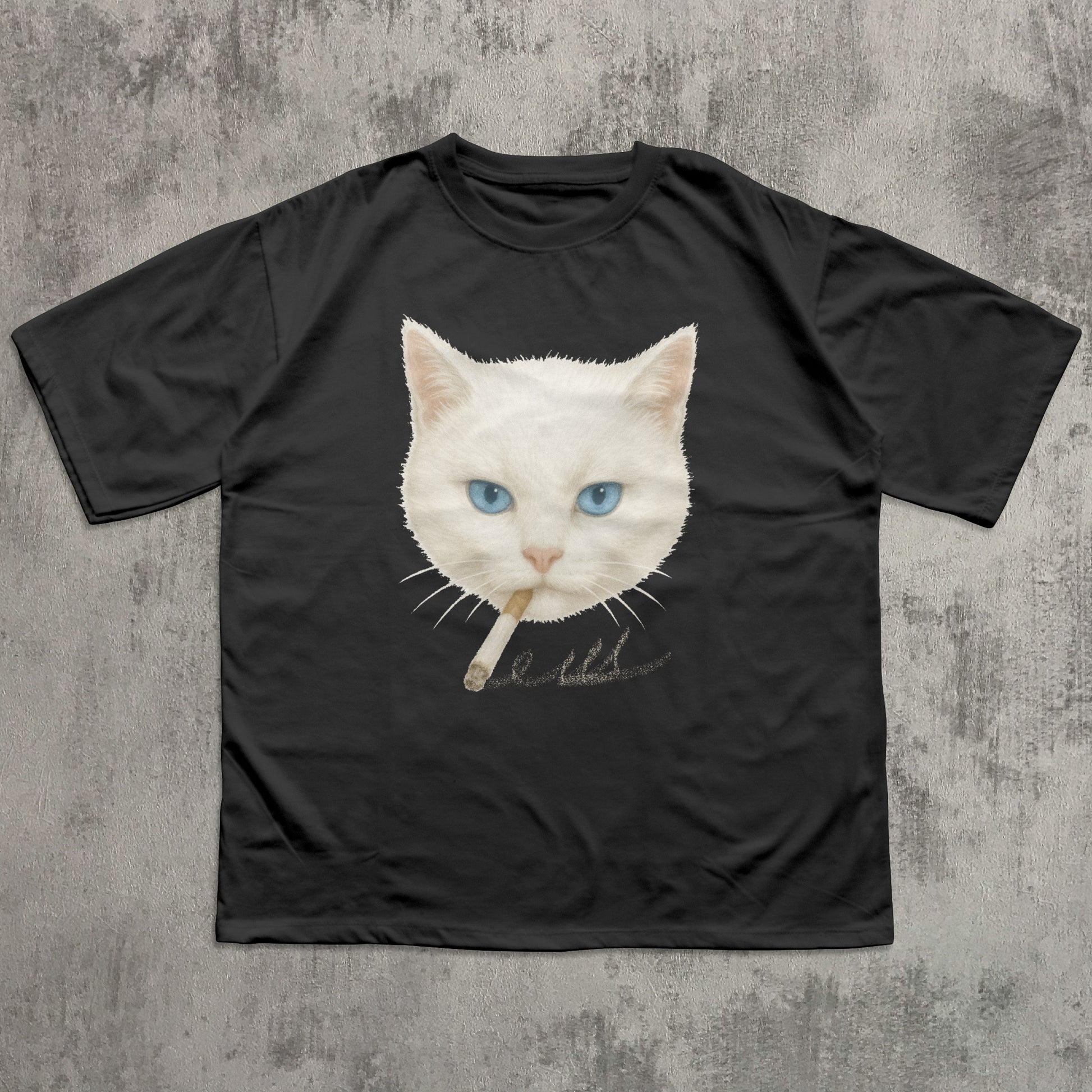 Black t-shirt with a graphic of a white cat with blue eyes on a textured gray background