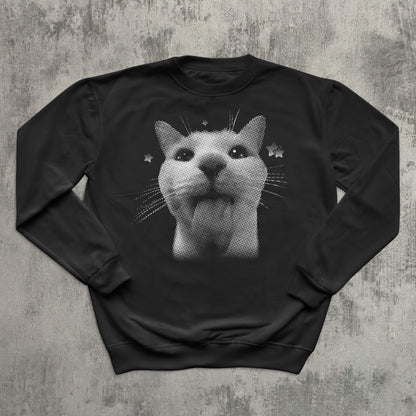 Black sweatshirt with a cat graphic on a textured gray background