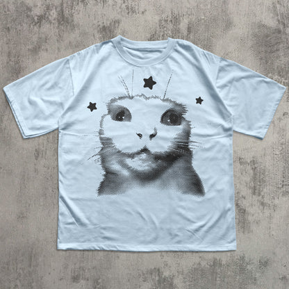 White t-shirt with a black and white cat graphic on a textured gray surface