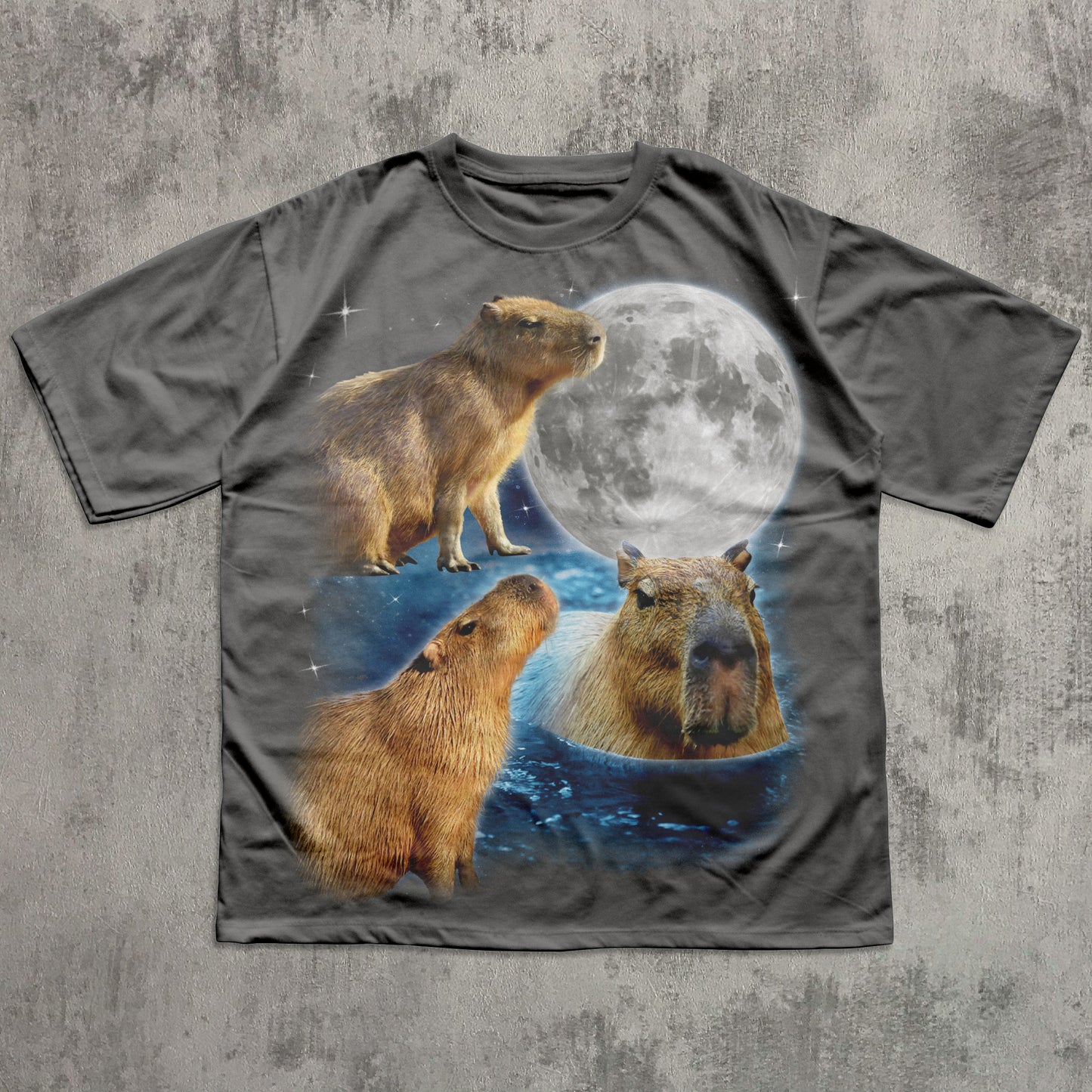 T-shirt with capybara design and moon on a textured gray background