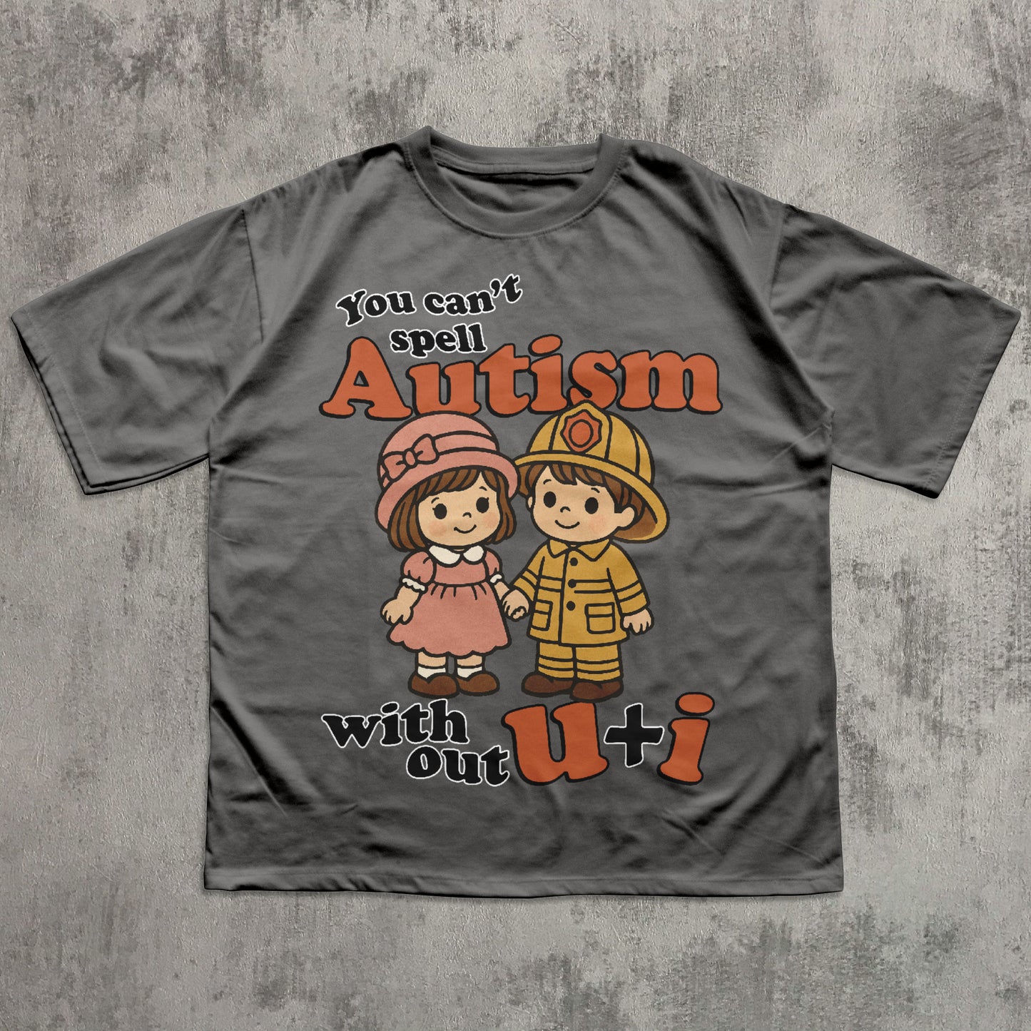 Gray t-shirt with cartoon characters and text on a textured gray background
