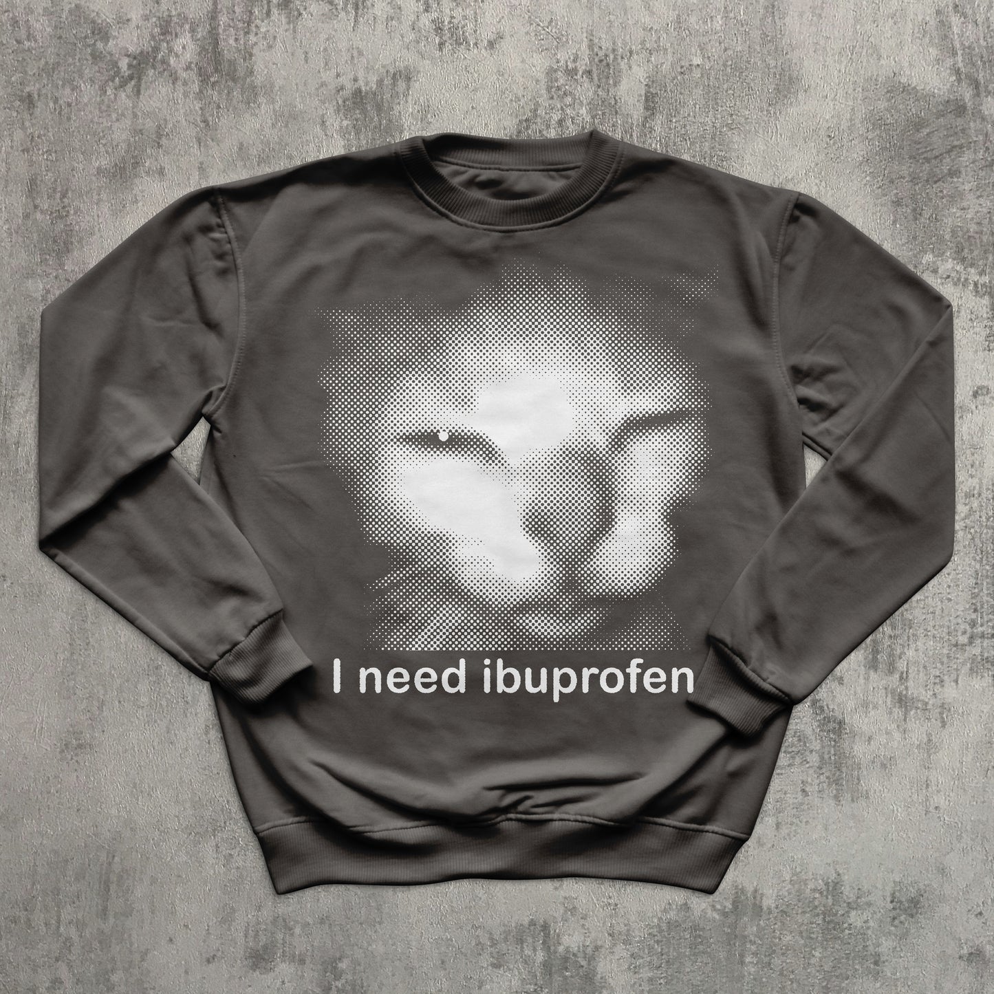 Gray graphic sweatshirt with retro halftone cat image and comedic quote ‘I need ibuprofen,’ trendy meme clothing.