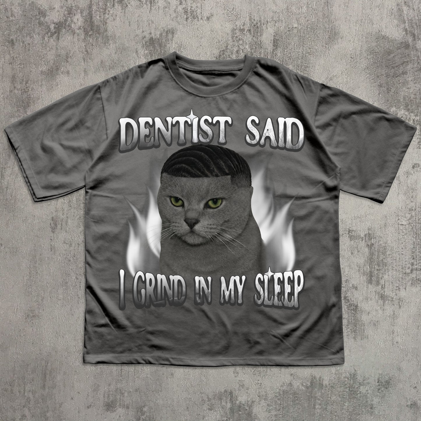 Gray t-shirt with a cat graphic and text on a textured gray background