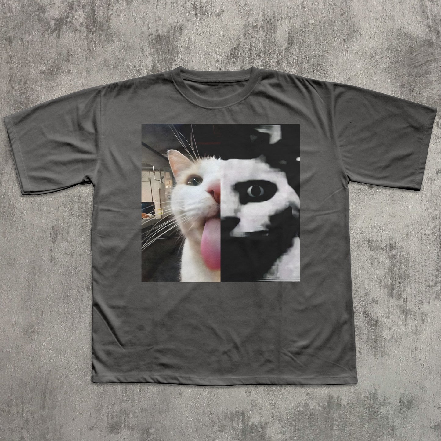 Gray t-shirt with a cat graphic on a textured gray background