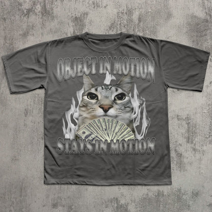 Gray t-shirt with a cat graphic and text on a textured gray background
