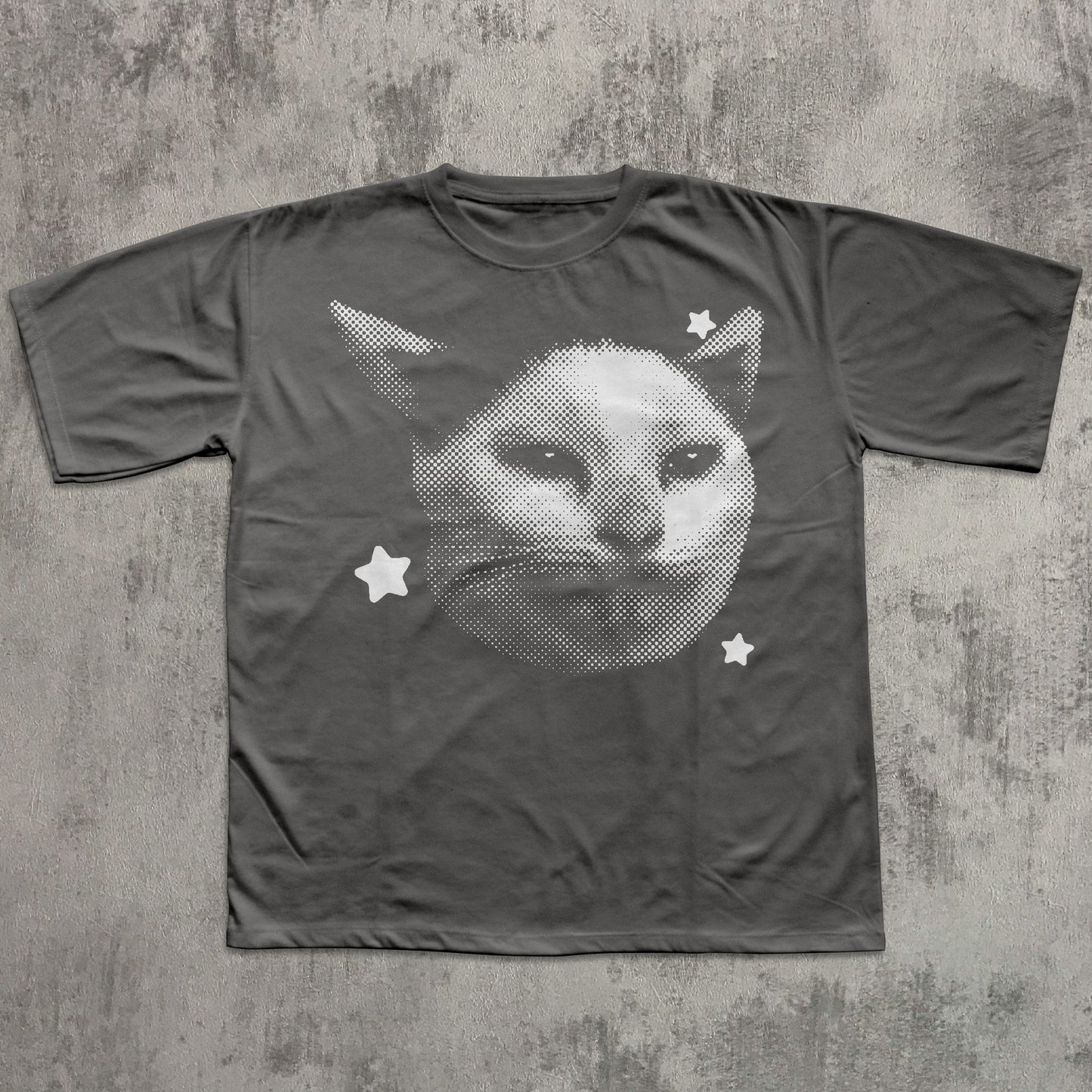 Gray t-shirt with a cat graphic design on a textured gray background