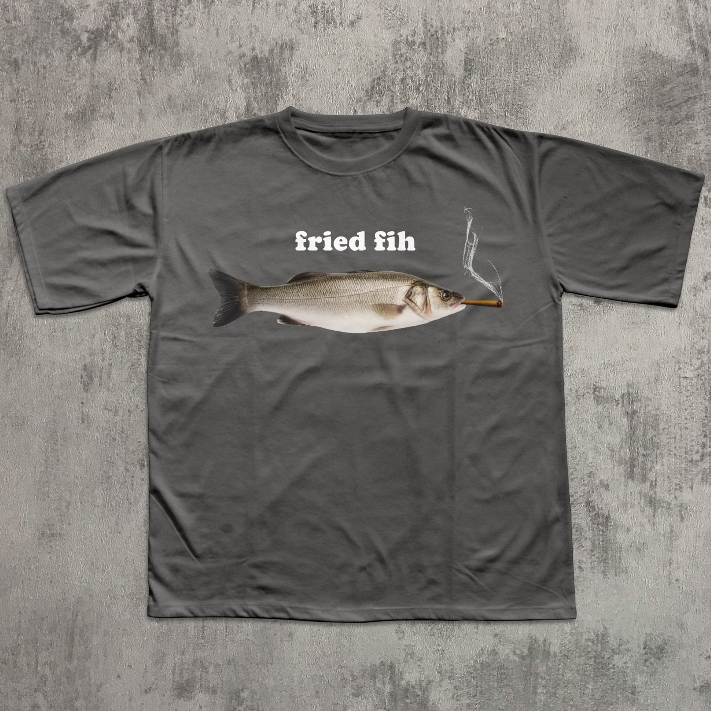Gray t-shirt with a fish graphic and 'fried fih' text on a textured gray background