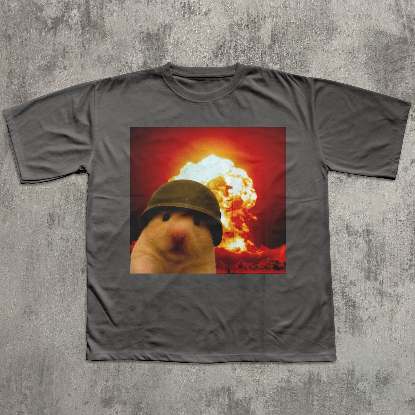 Gray t-shirt with a graphic of a hamster wearing a helmet in front of an explosion on a textured gray background