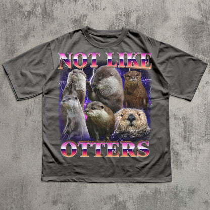 T-shirt with otter illustration and text 'Not Like Otters' on a textured gray background