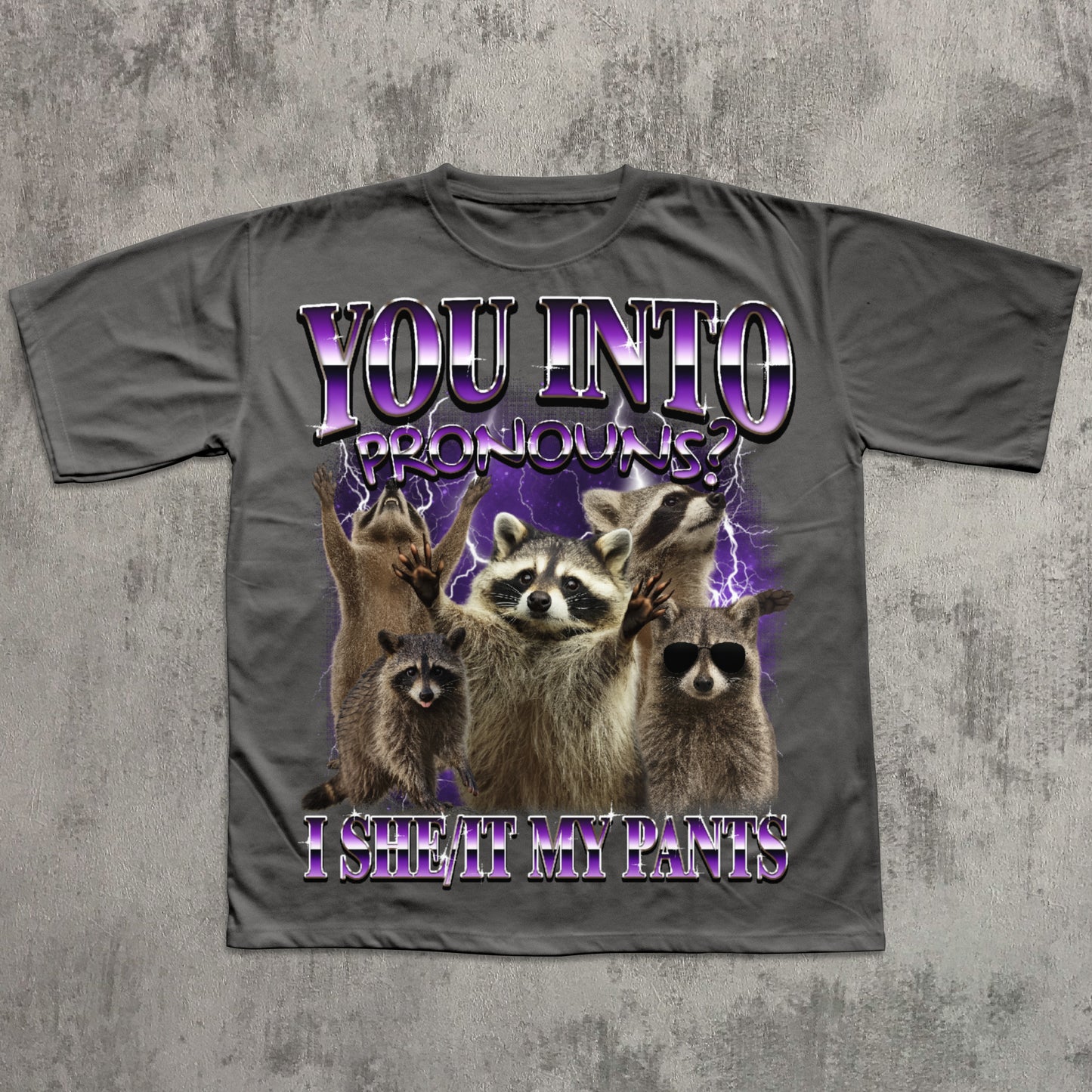 Gray t-shirt with raccoon graphic and humorous text on a textured gray background
