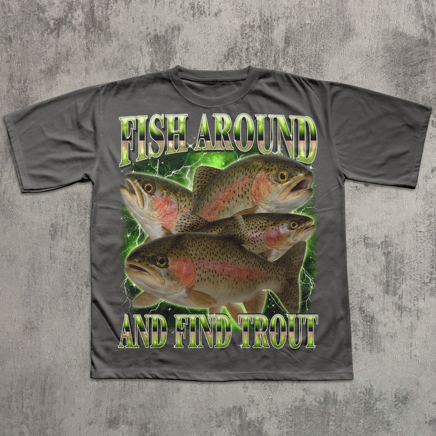 Gray t-shirt with fish graphic and text 'Fish Around And Find Trout' on a textured gray background