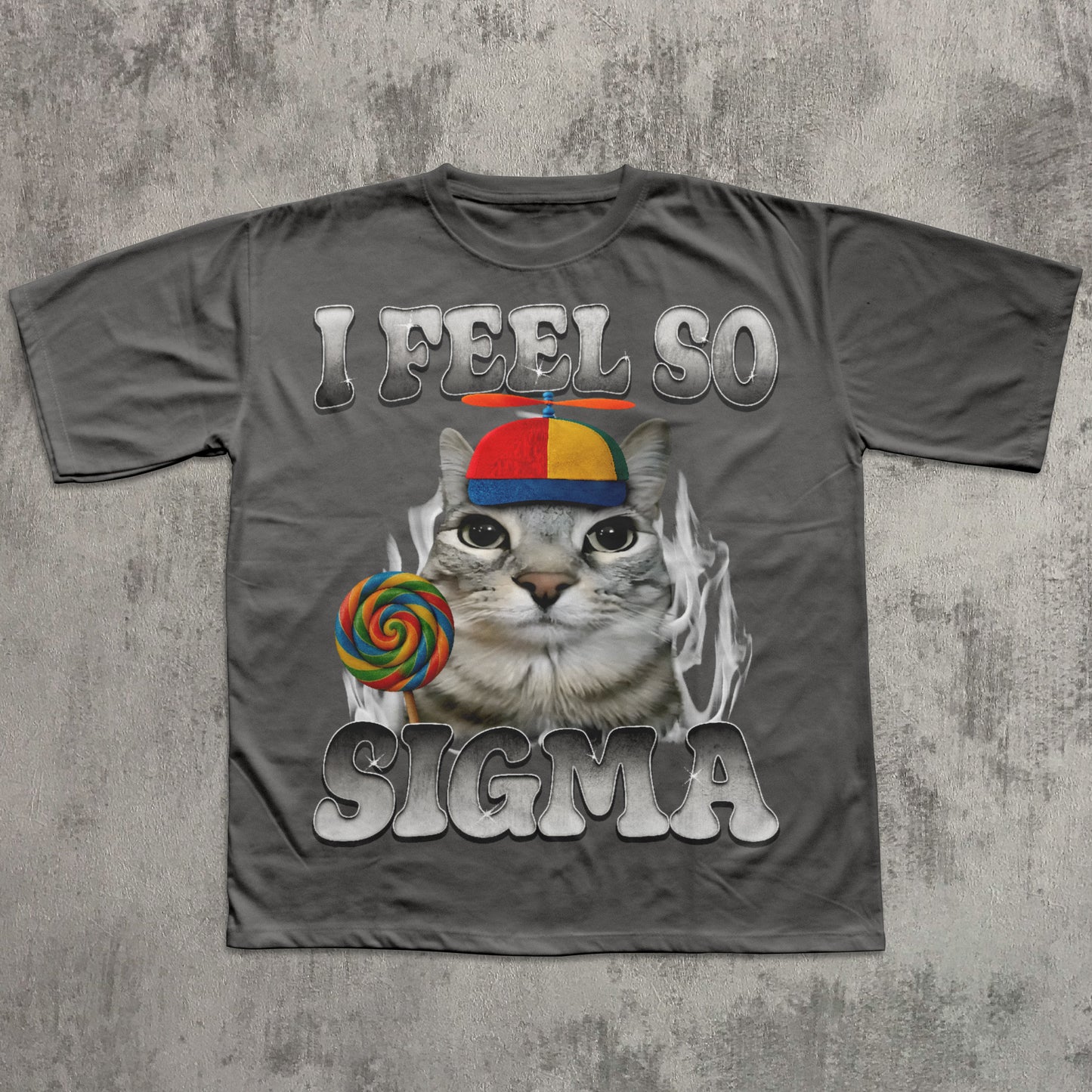 Gray t-shirt with a cat graphic and text 'I Feel So Sigma' on a textured gray background