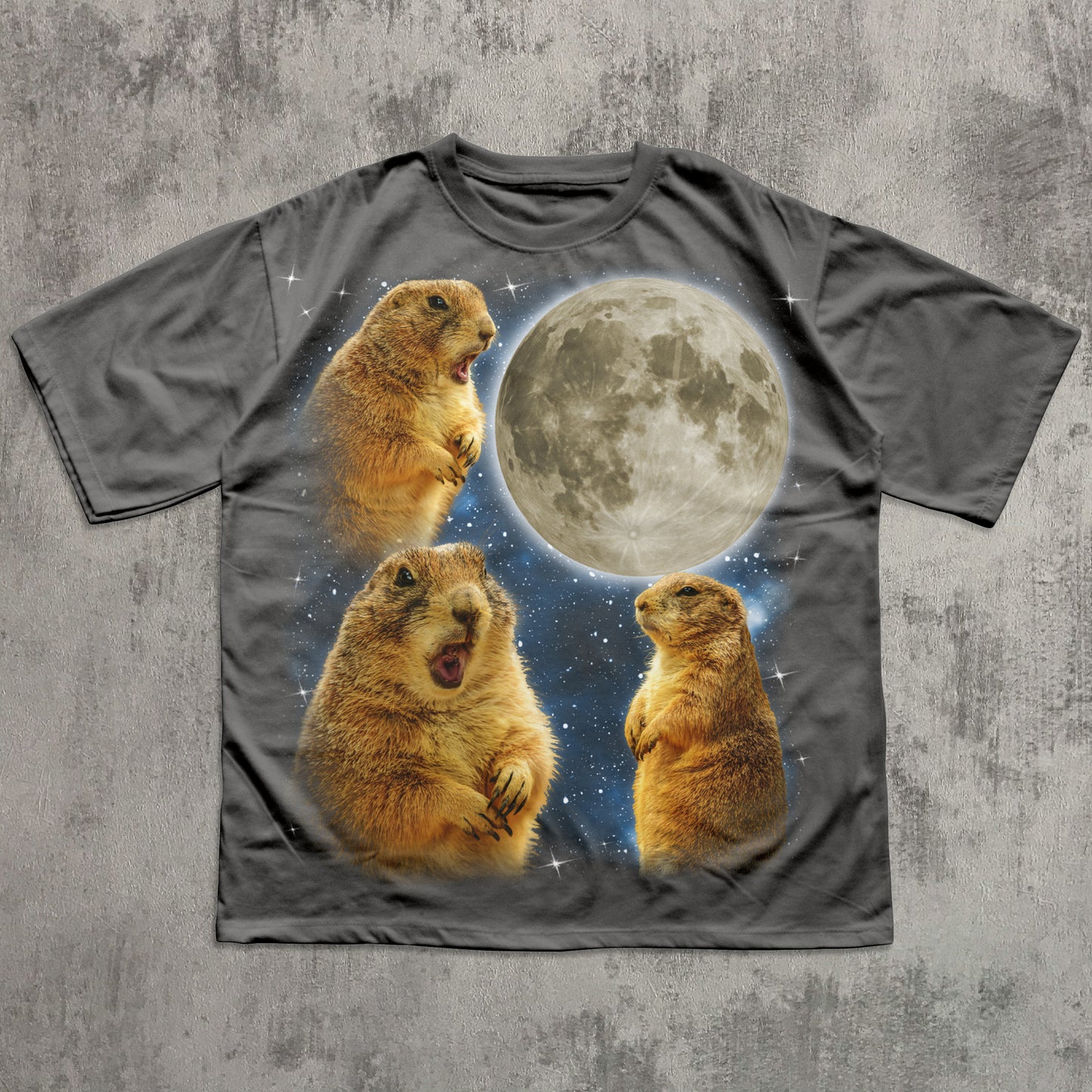 Gray t-shirt with prairie dogs and a moon graphic on a textured gray background