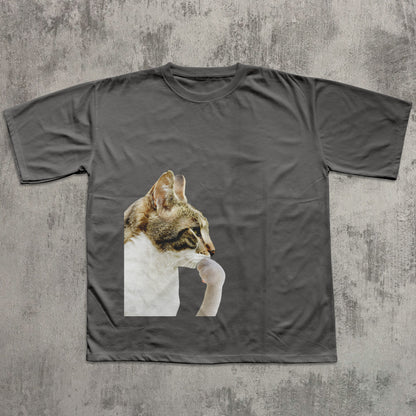 Gray t-shirt with a cat graphic on a textured gray background