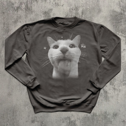 Gray sweatshirt with a cat graphic on a textured gray background