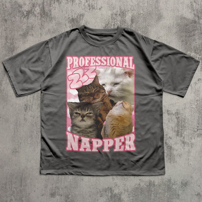 Funny Gray t-shirt with a graphic of cats and the text 'Professional Napper' on a textured gray background