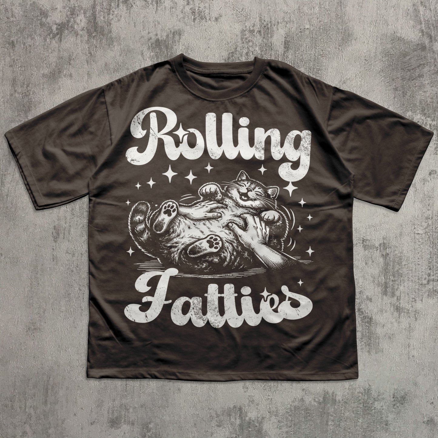 Brown t-shirt with graphic design and text 'Rolling Fatties' on a textured gray background