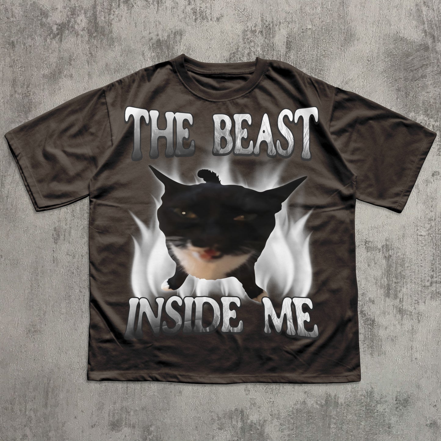 T-shirt with a graphic of a cat and text 'The Beast Inside Me' on a textured gray background