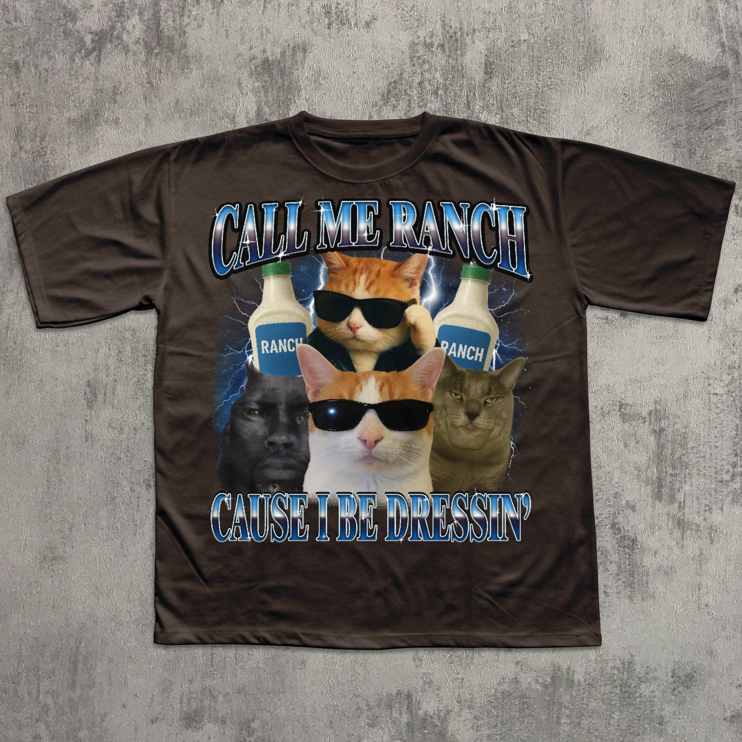 Brown t-shirt with cat graphic and text 'Call Me Ranch Cause I Be Dressin'' on a textured gray background