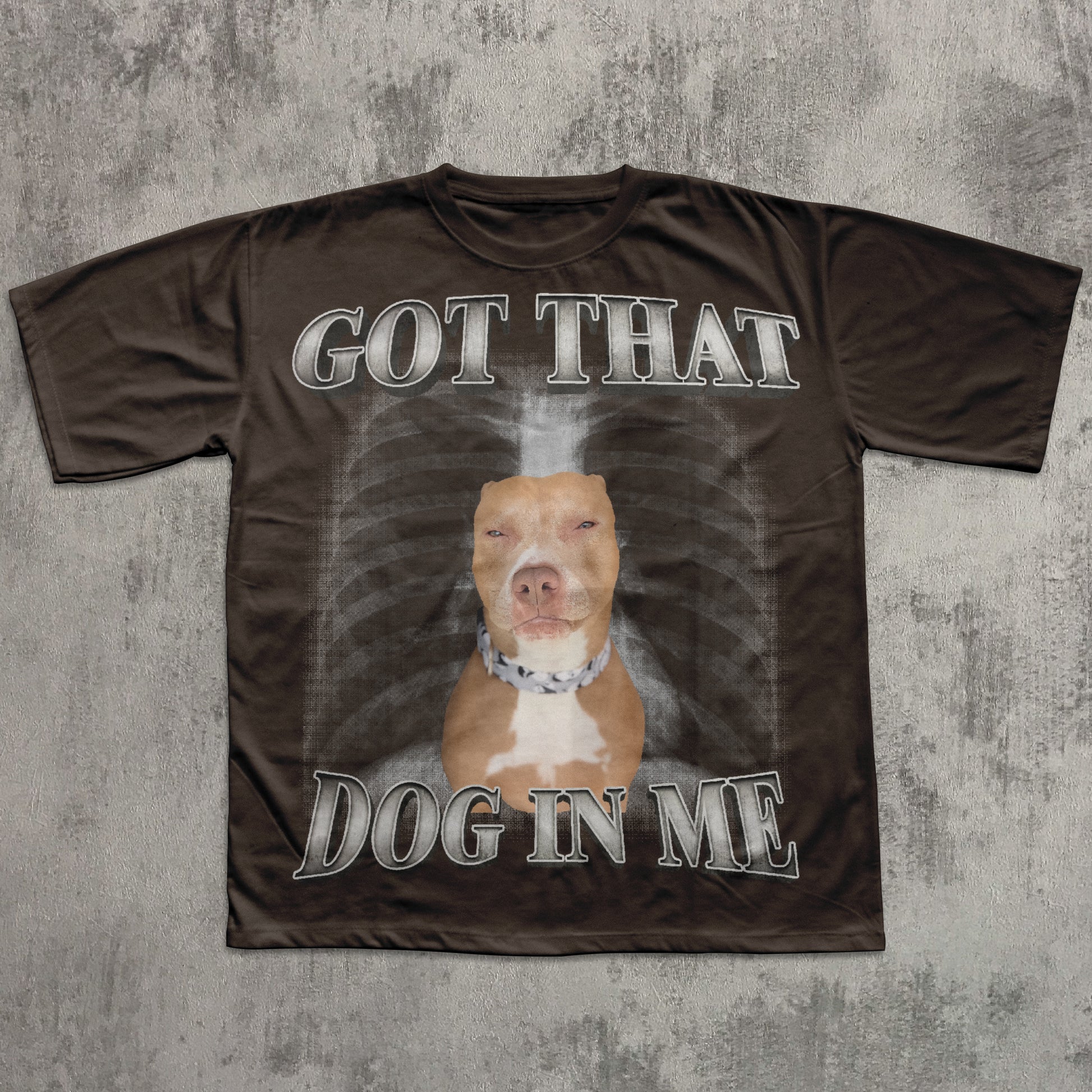 T-shirt with a graphic of a dog and text 'Got That Dog In Me' on a textured gray background