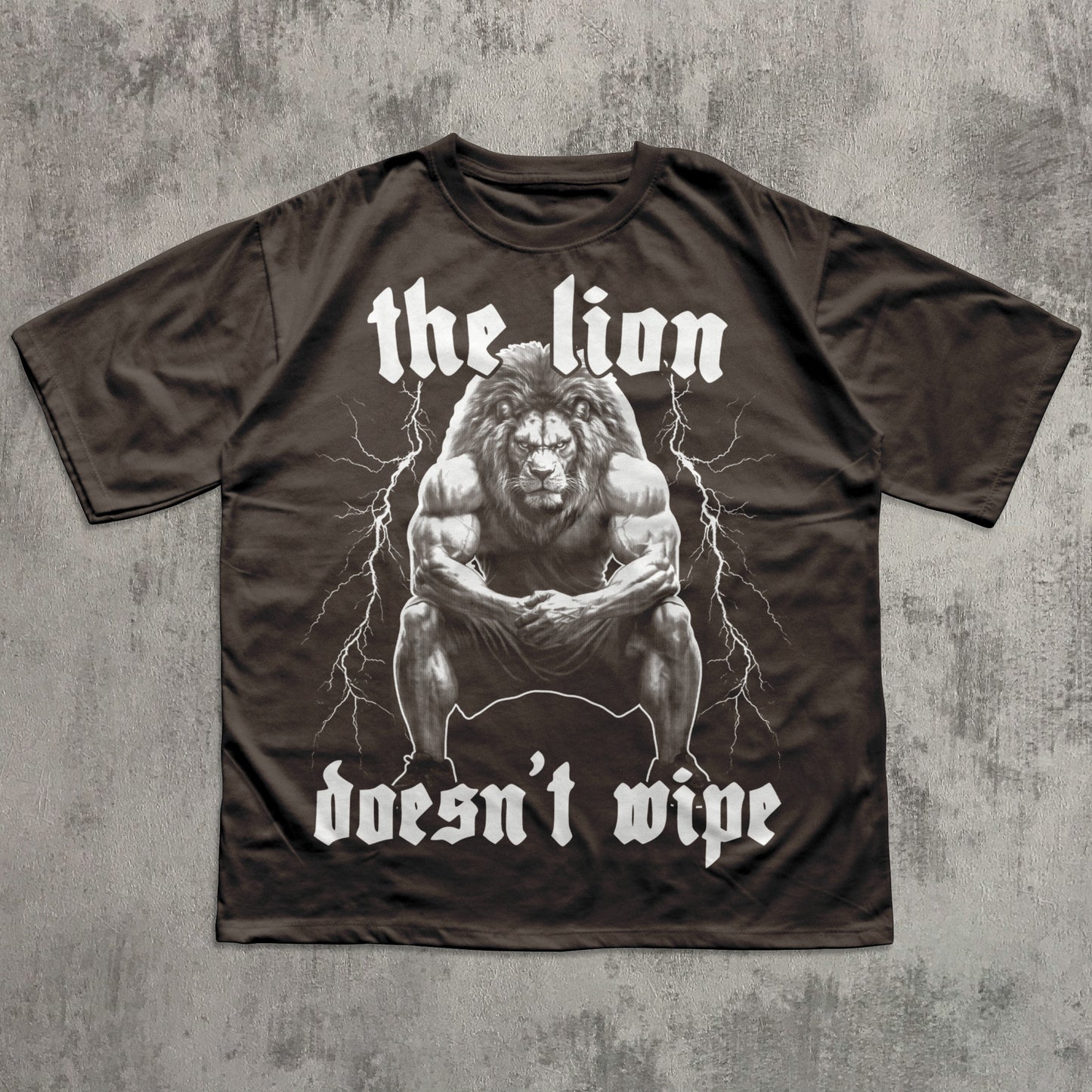Brown t-shirt with a graphic of a lion and text on a textured gray background